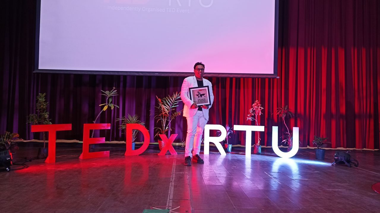 CA Drupad Patel on the TEDx RTU stage